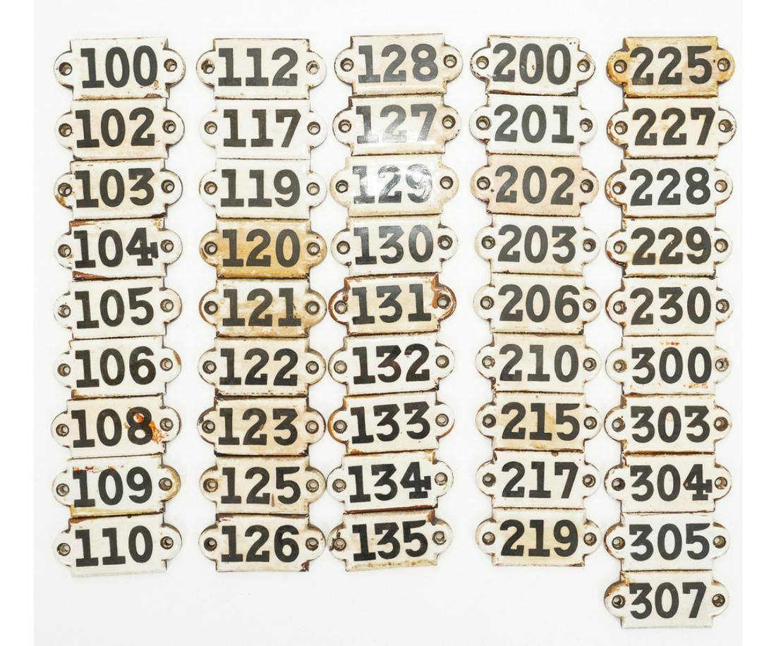UNION PORCELAIN WORKS TILES: Hotel room number tiles by Union Porcelain Works (1862-1922, American), marked on back U.P.W. and an eagle, 46 pieces. 1.5"l x 3.25"w