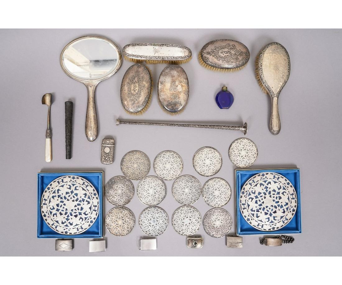 STERLING SILVER DRESSER SETS etc.: Sterling silver dresser sets, round glass trivets, belt buckles and an ornate sterling silver match case etc. Trivet: 6"dia