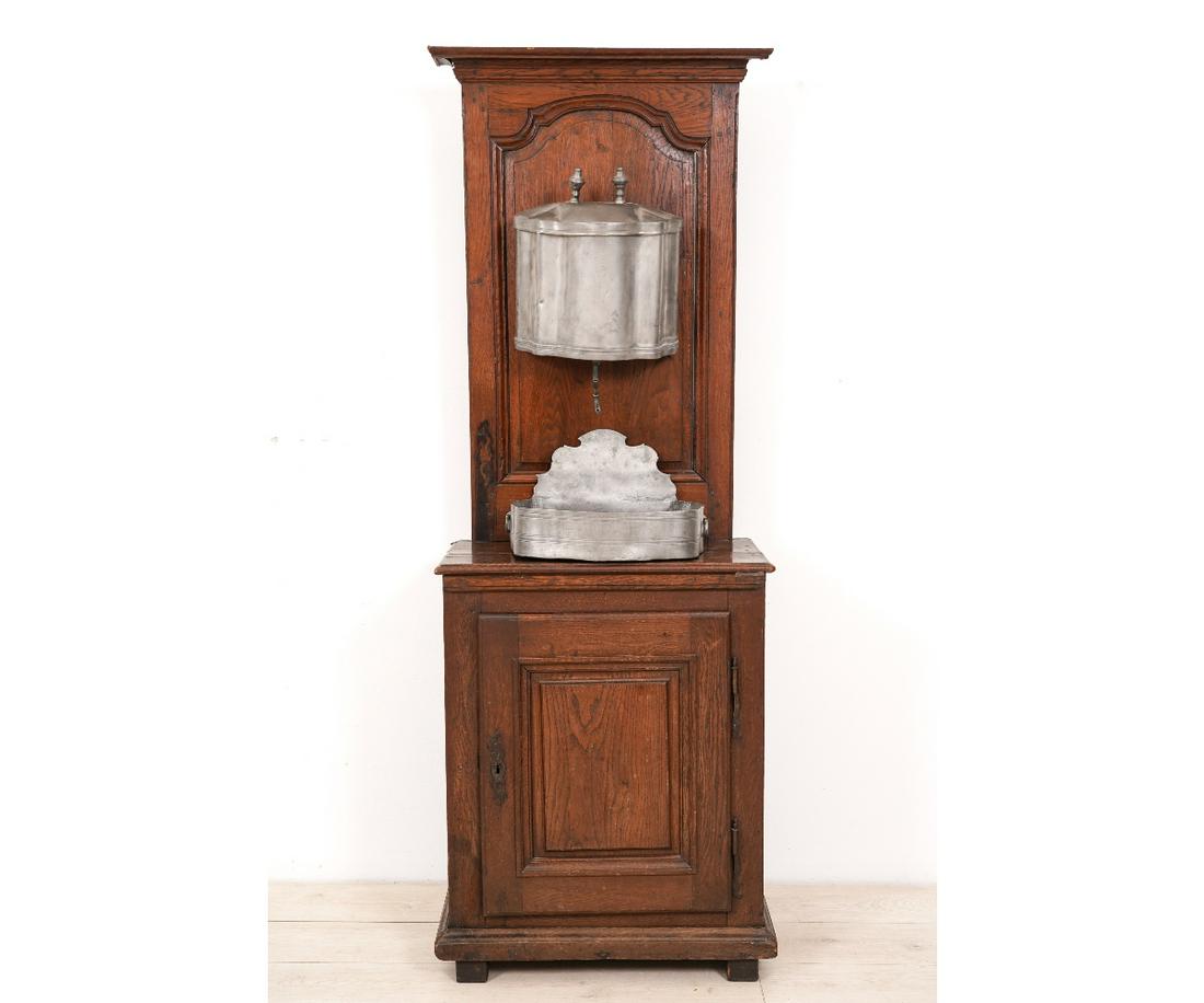 FRENCH OAK LAVABO: French oak lavabo, 18th c., from Provence, with pewter reservoir and wash basin. 74"h x 26"w x 15.5"d