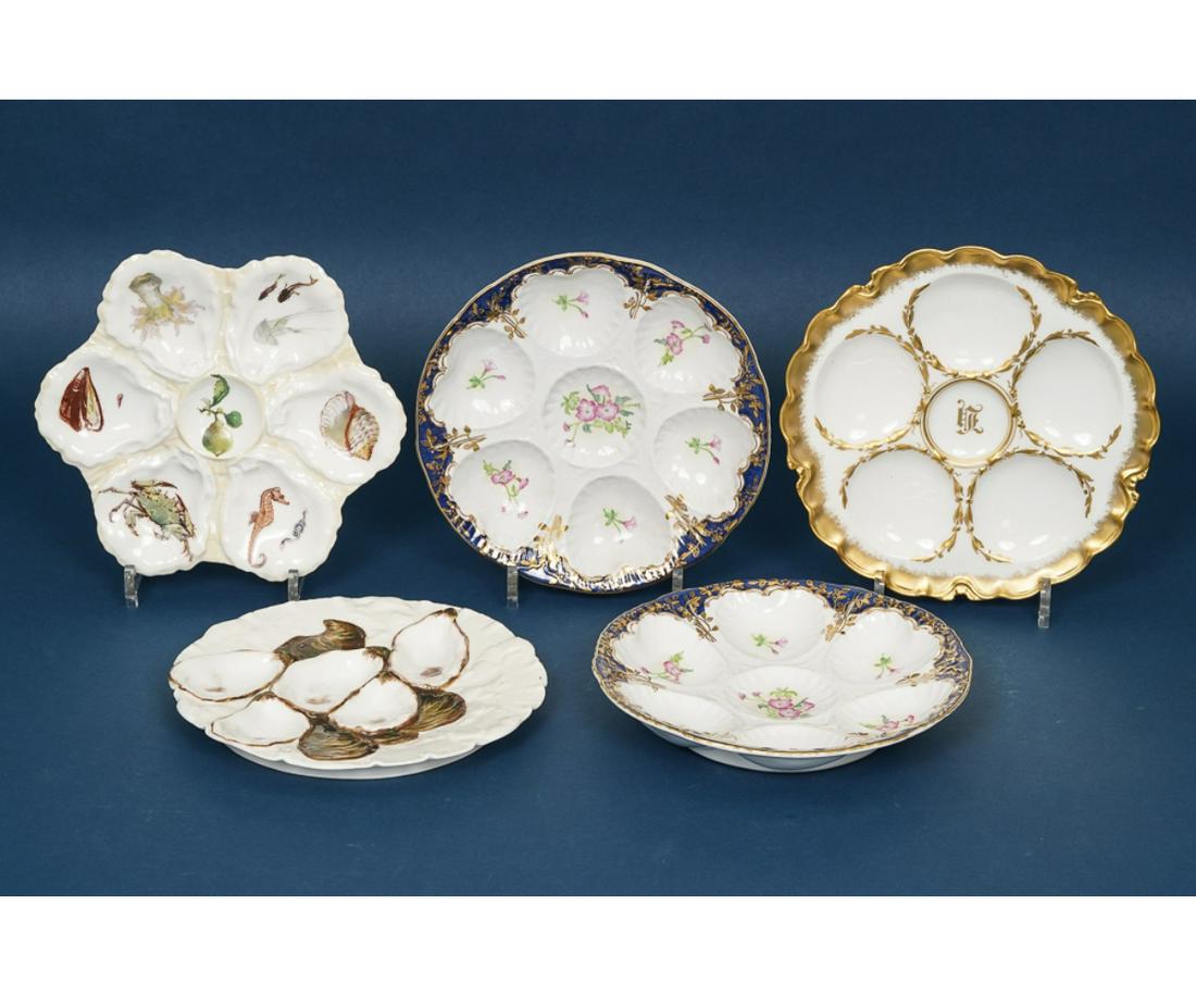 LIMOGES OYSTER PLATES: Five Limoges oyster plates one decorated with a seahorse, shells and a crab. Largest: 9.25" dia