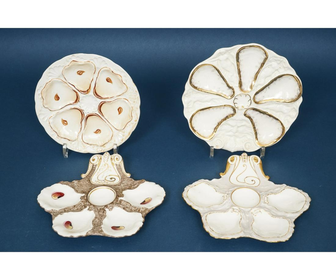 FOUR FRENCH LIMOGES OYSTER PLATES: Four French Limoges oyster plates one with a "Northwind Mask", circa 1880. Largest: 9"dia