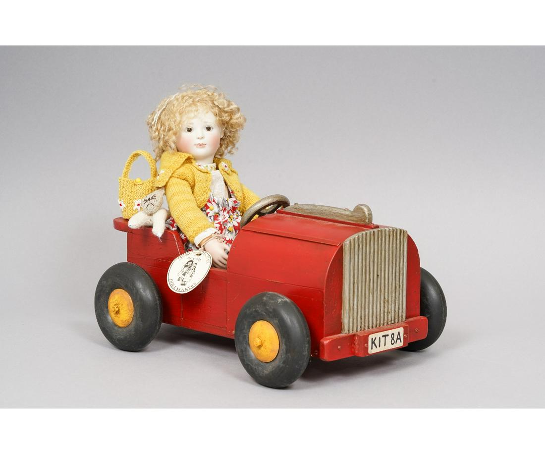 LYNNE & MICHAEL ROCHE "KITTY & CAR": "Kitty with Car" by Lynne & Michael Roche, special edition #8 of 20 and dated 2002, porcelain head and hands, articulated wood body, original tags along with her red car, kitty cat and purse. Kitty: 1