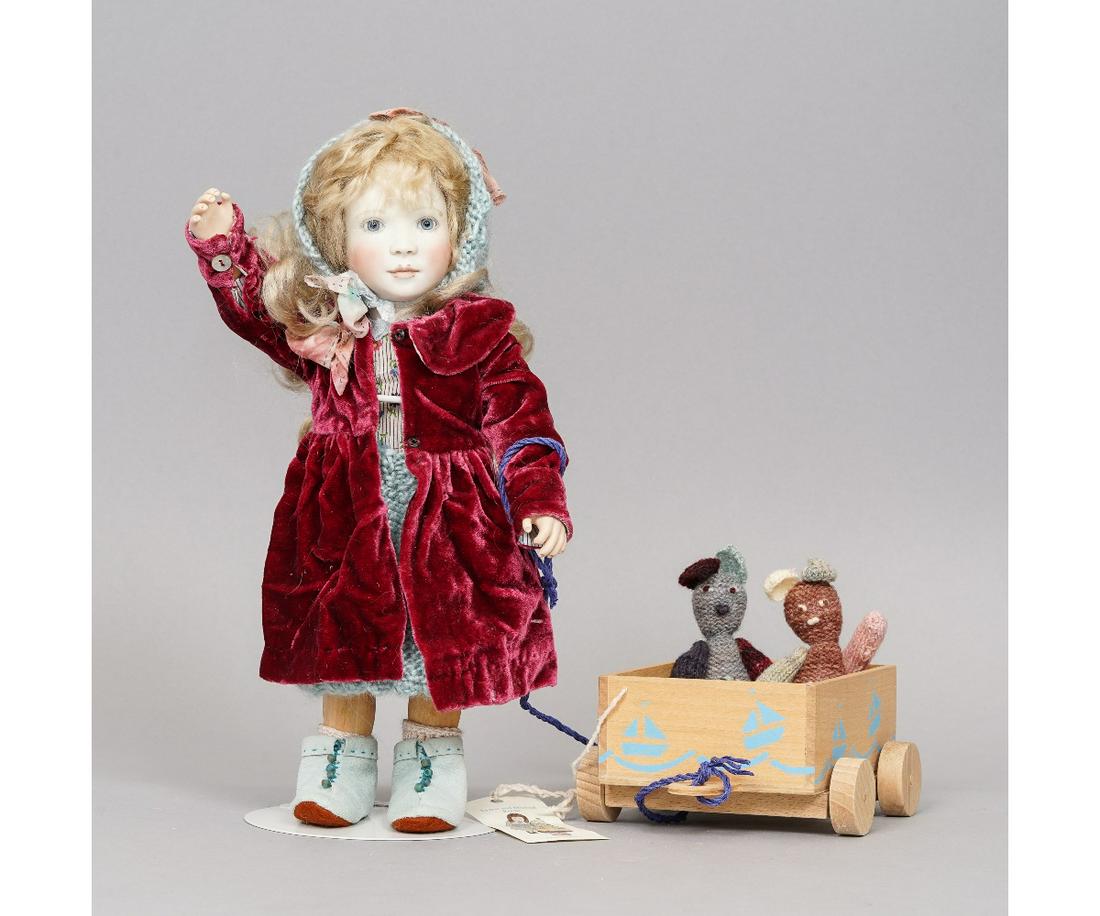 LYNNE & MICHAEL ROCHE "DAISY": "Daisy in Winter" art doll by Lynne & Michael Roche, limited edition #5 of 20, dated 2014, porcelain head and hands, articulated wooden body. Included is Daisy's wooden cart with 2 knit bears and a pa