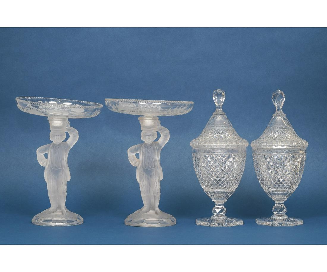 PAIR SILVER MIST FIGURAL COMPOTES: Pair of Fostoria silver mist figural compotes, probably late, 19th c., 10.75"h x 7.75"w; together with a pair of crystal covered urns, 12"h