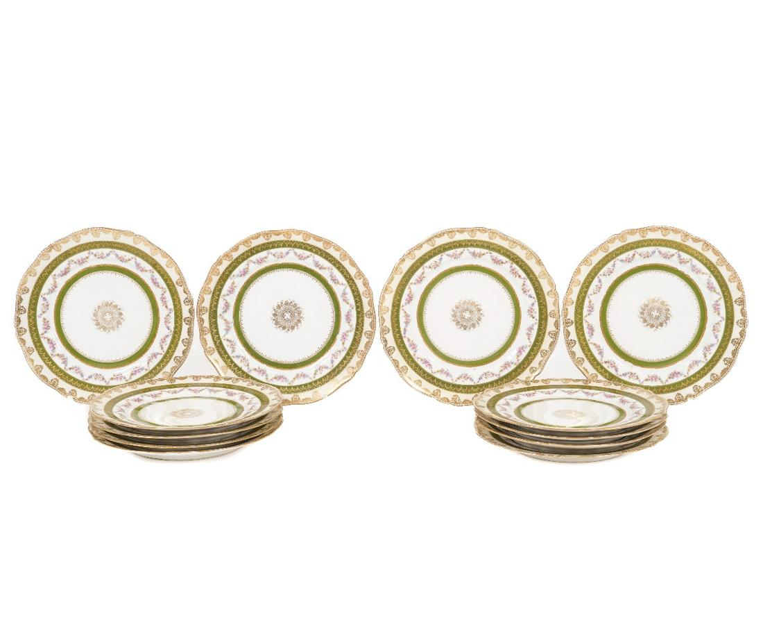 HAVILAND LIMOGES PLATES: Set of twelve Haviland Limoges plates each decorated with colorful garland swags and gilt borders. 10"dia