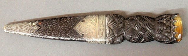 Sgian-dubh (Scottish dirk) with a carved ebony hi: Sgian-dubh (Scottish dirk) with a carved ebony hilt mounted with a citrine-type stone and both hilt and sheath with hallmarked silver mounts, Edinburgh, Scotland, c.1895. 7”l.