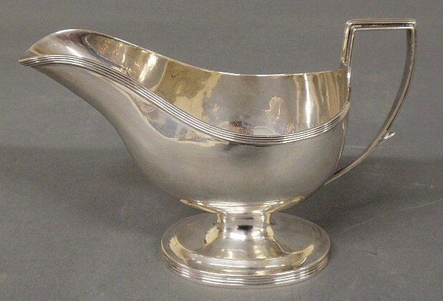 Regency silver sauce or gravy boat by London silv: Regency silver sauce or gravy boat by London silversmith William Bennett, 1807, Roman helmet shaped on a pedestal base with reeded borders. 8”l.x4.875”, 10.205 troy oz.