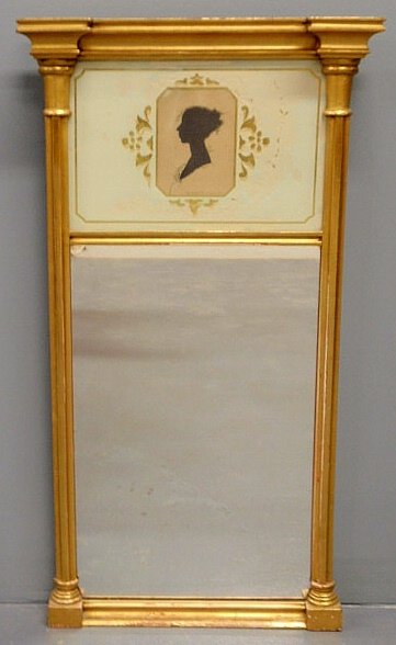 Reproduction Sheraton gilt mirror with a silhouet: Reproduction Sheraton gilt mirror with a silhouette of Harriet Clarke, the original is in the Essex institute in Salem, Mass. 28.5”h.x16”w.
