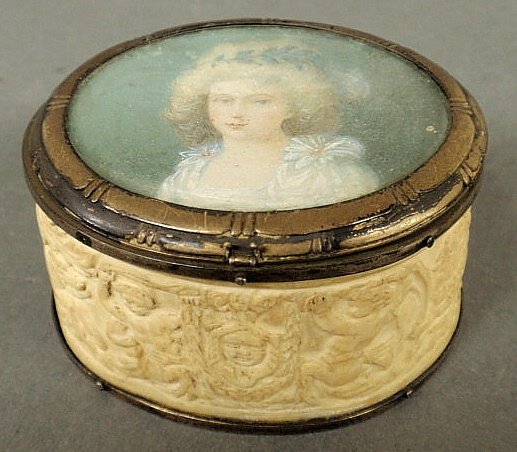 Oval French carved ivory box, early 19th c., deco: Oval French carved ivory box, early 19th c., decorated with figures and animals, the lid with an inset portrait of a young woman. 1.5”h.x2.5”l.x2”d.