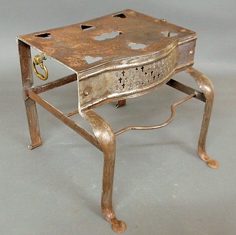 Metal hearth stand, early 19th c., with cut-out h: Metal hearth stand, early 19th c., with cut-out heart decoration and brass handles. 13”h.x15”w.x15.25”d.