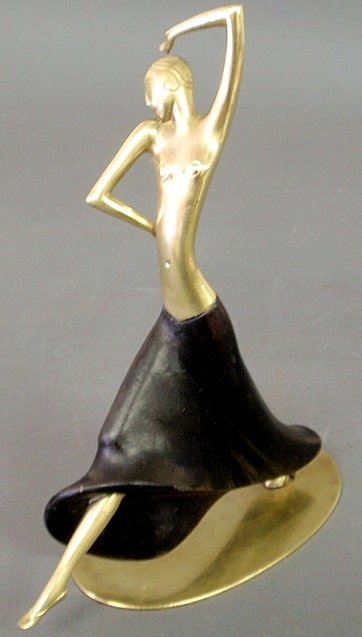 Hagenauer brass and ebonized wood dancing figure,: Hagenauer brass and ebonized wood dancing figure, c.1920, mounted on an oval brass base. 11.75”h., base 7.5”x4”