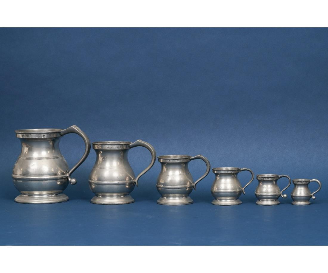 ENGLISH PEWTER MEASURES: Six English pewter measures, 19th c., the largest (6"h x 7"w) is one quart.