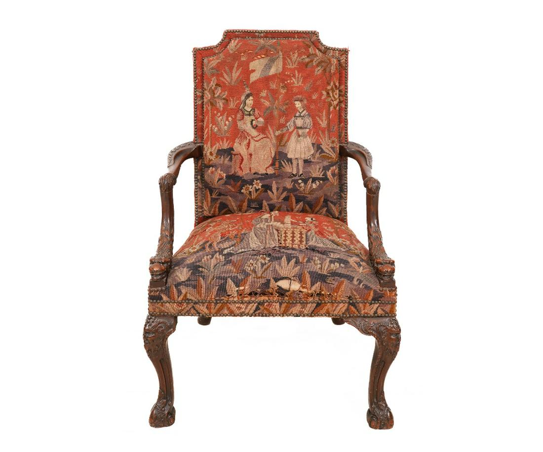 FRENCH BAROQUE ARMCHAIR: French Baroque style walnut tapestry upholstered open armchair with carved grotesque animal arm supports and mask carved knees with acanthus feet. 42"h x 27"w x 20"d / 17" SH