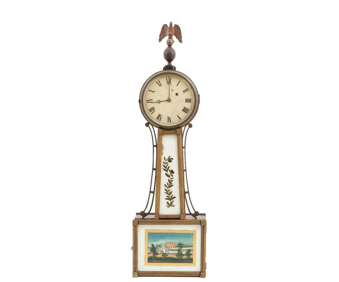 EARLY BANJO CLOCK: Early mahogany banjo clock, 19th c., unsigned with brass and wood eagle finial, reverse painted eglomise throat and door panels. 35.25"h x 10"w x 4"d