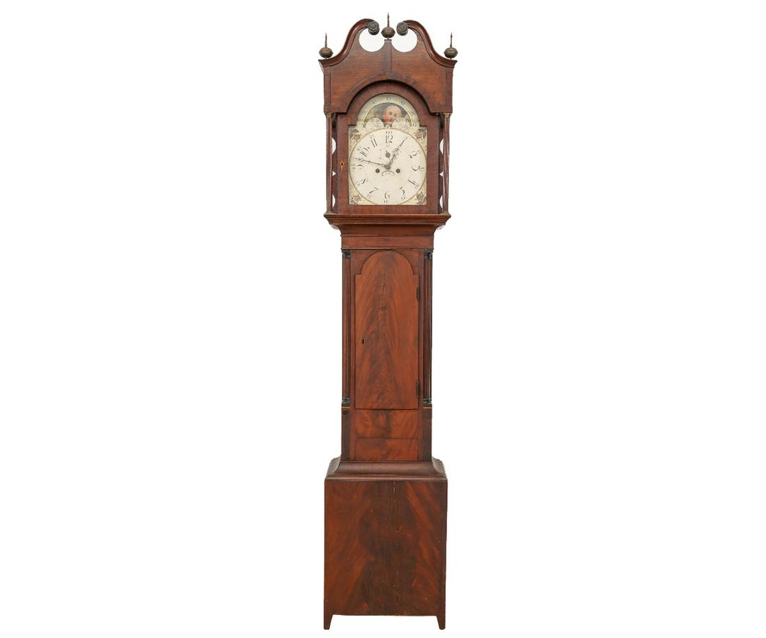 TALL CASE CLOCK: New Jersey mahogany inlaid tall case clock with broken arch bonnet, 8-day works with moon dial, fluted corner columns and tombstone door, all resting on French feet. 92"h x 18.5"w x 10.5"d