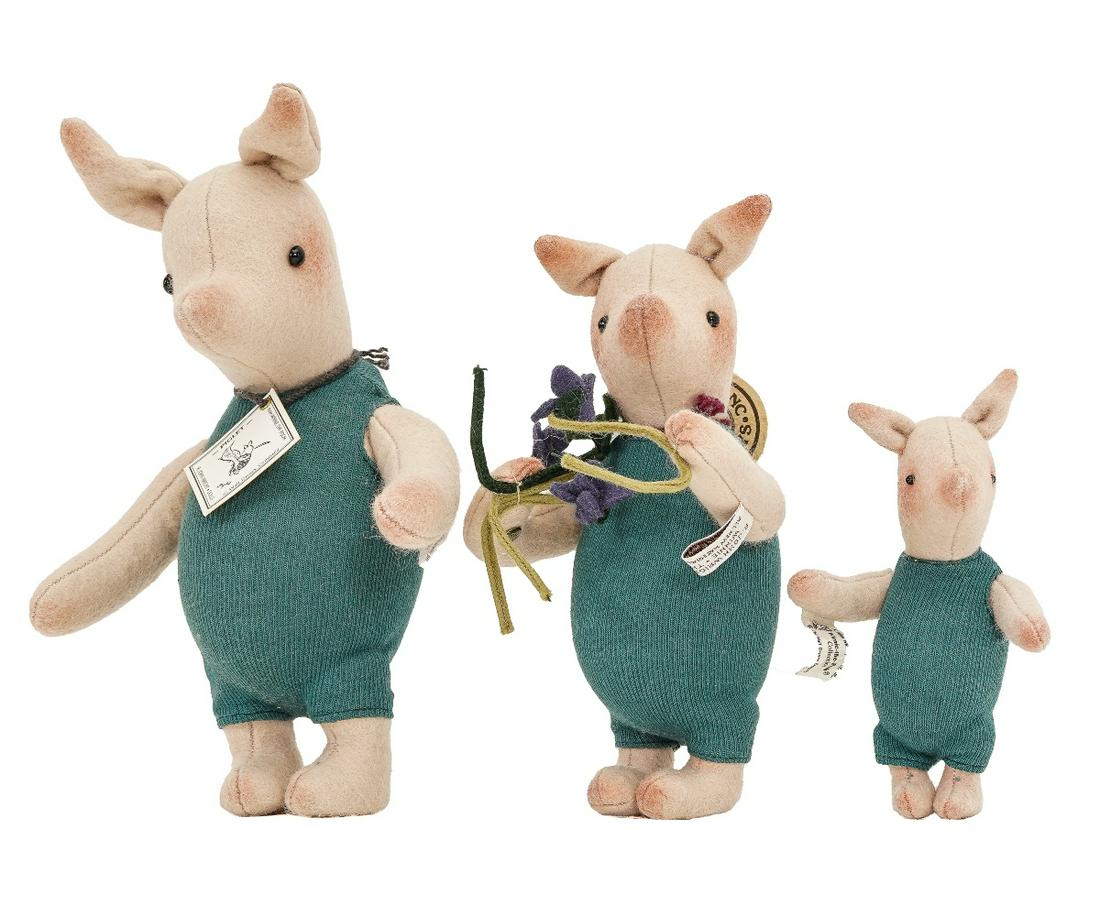 "PIGLETS" BY R. JOHN WRIGHT: Three R. John Wright Piglet dolls from the Winnie-the-Pooh series, the largest marked #703/1000 with original tags, 9"h; together with a medium size Piglet with button marked RJW, original box, 7.5"h