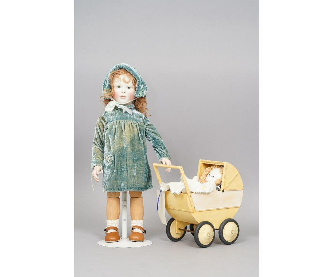 LYNNE & MICHAEL ROCHE "LOUISA WITH PRAM": "Louisa with Pram" artist doll by Lynne & Michael Roche, limited edition #5/12 dated 2001, original tag, porcelain head/hands, articulated wooden body. Louisa is with her yellow pram and dolly. Louisa