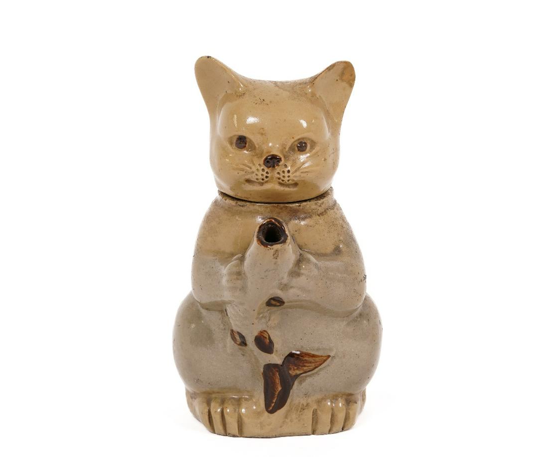 CHINESE CAT TEAPOT: Chinese figural cat teapot, 19th c., the spout in the form of a fish head. 6.5"h x 5.5"w x 3.5"d