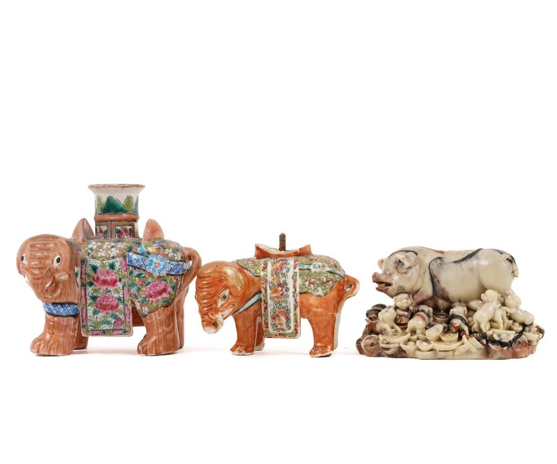 CHINESE PORCELAIN FIGURES: Chinese porcelain elephant candle holder, 19th c.; together with a smaller example and a stone carved sow with babies. Largest: 5"h x 5"l x 4.5"d