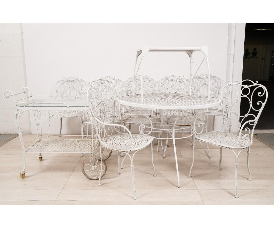METAL OUTDOOR FURNITURE: Metal outdoor furniture to include a tea cart by "Woodard IV"; together with ten chairs, round table and a rectangular example. Table: 29"h x 41.5"dia / Chairs: 37"h x 18.75"w x 17.5"d / 16.5" sh