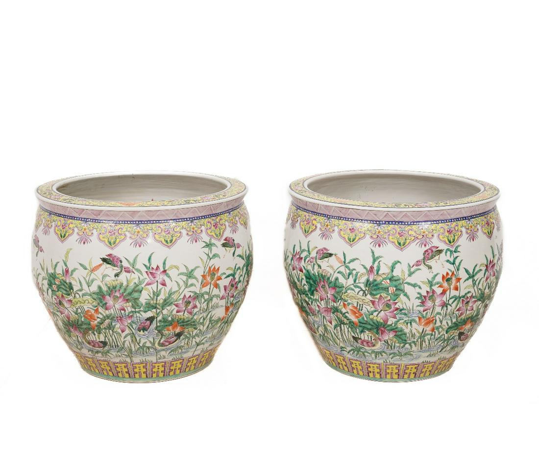 LARGE CHINESE PLANTERS: Two massive porcelain Chinese planters decorated with flowers, fish and birds, 20th c. 18"h x 21"dia