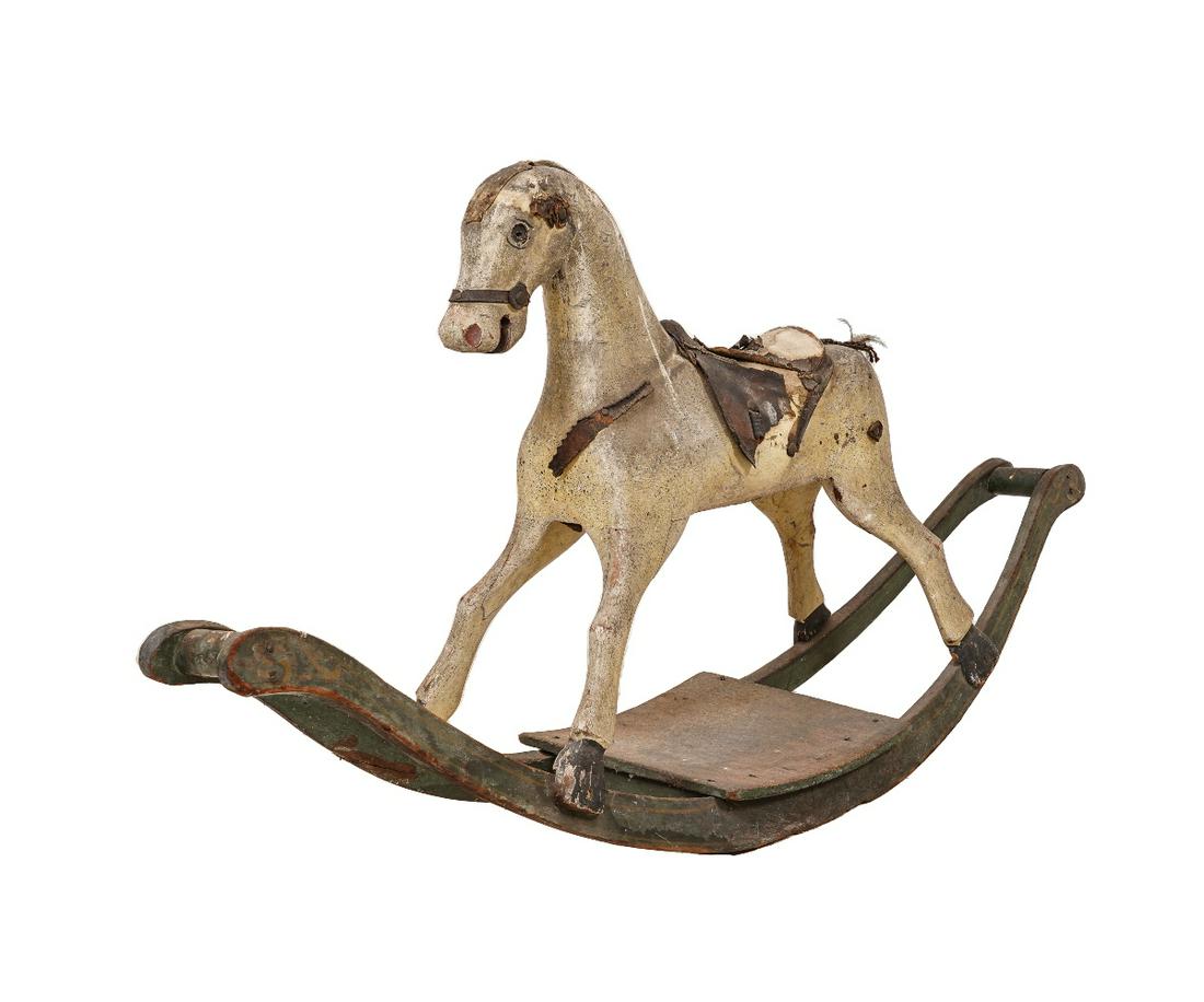 EARLY ROCKING HORSE: Early rocking horse, late 19th c., with original paint decoration. 29.5"h x 59"l x 13"d