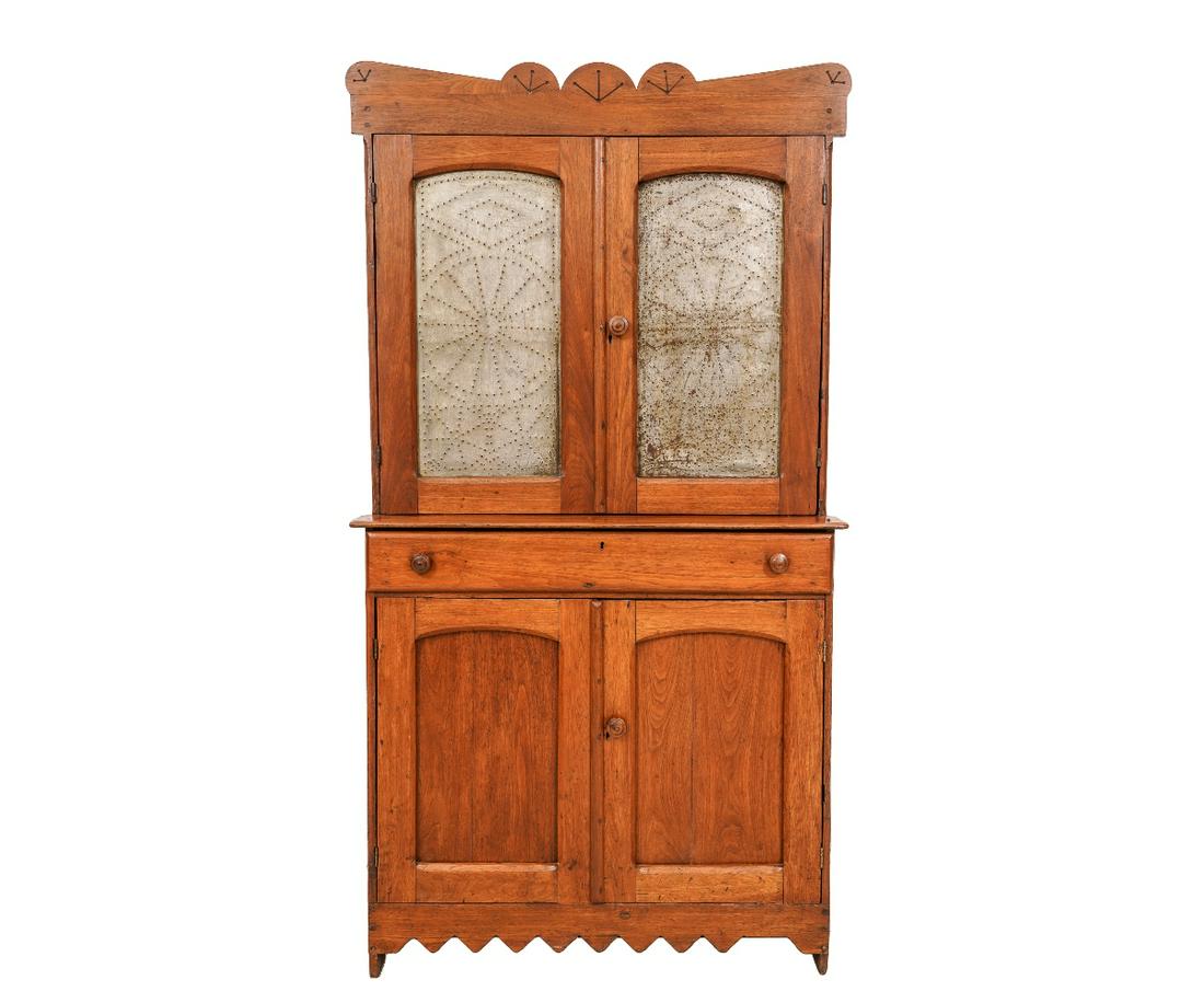 COUNTRY WALNUT STEP BACK CUPBOARD: Country walnut step back cupboard/pie safe with punched tin panels, circa 1860, with painted red interior. 71"h x 38"w x 19"d