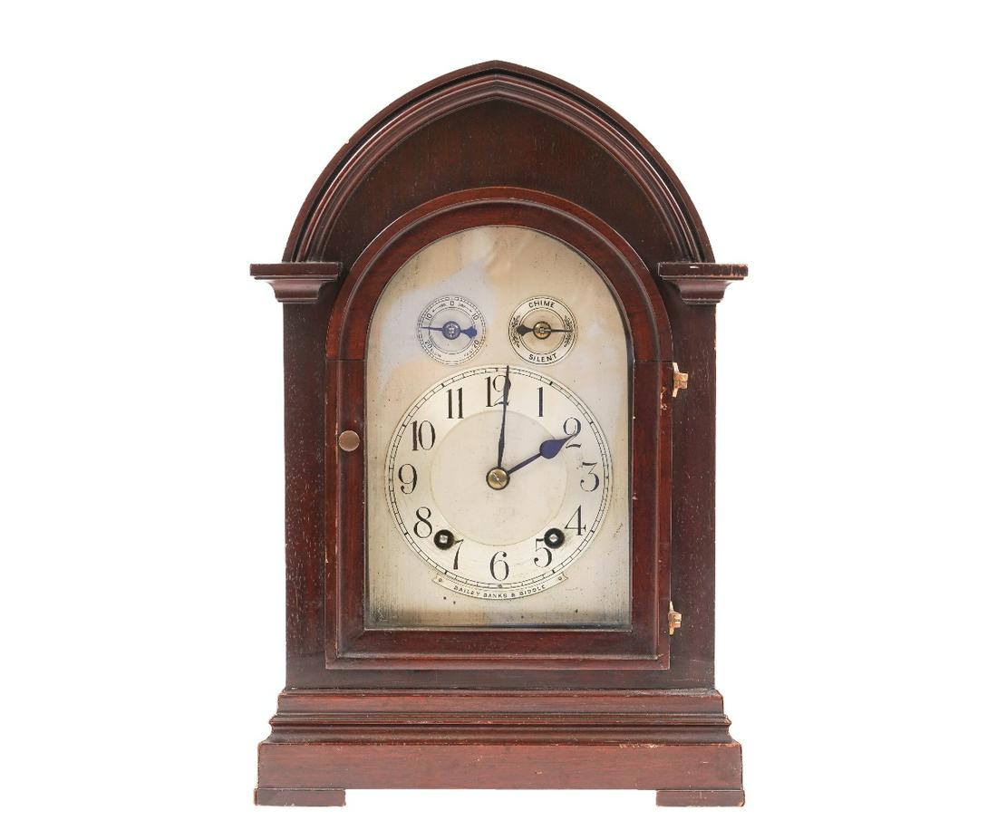 WINTERHALDER & HOFMEIER CLOCK: Winterhalder & Hofmeier mahogany table clock signed Bailey, Banks & Biddle, with original label. 16"h x 10.5"w x 7.75"d