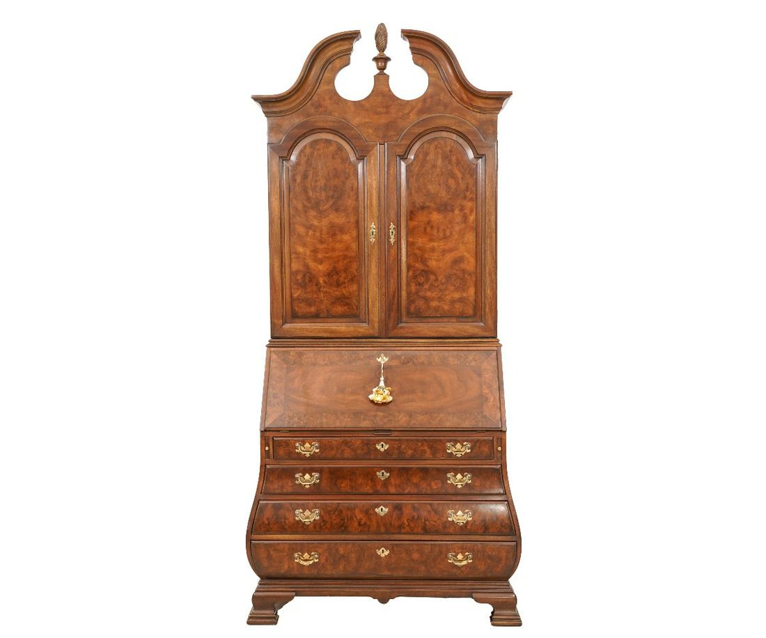 HERITAGE BOMBE SECRETARY/BOOKCASE: Heritage Chippendale style figured mahogany bombe two-piece secretary/bookcase, the original was made in Charlestown, Mass., circa 1775. This is a limited edition #29 of 240 accompanied with plaque. 9