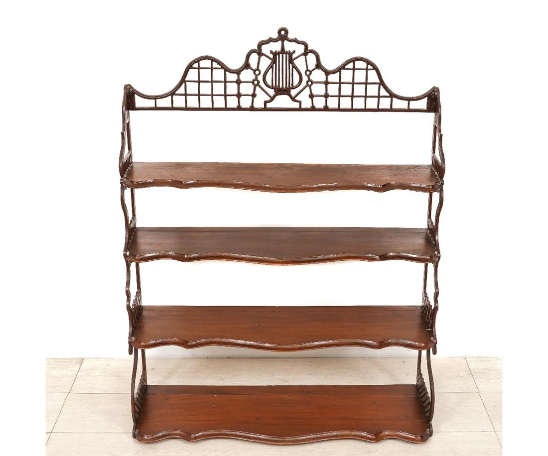 IRON AND MAHOGANY HANGING SHELF: Iron and mahogany hanging shelf, late 19th c., with lyre form crest. 41.75"h x 31.5"w x 8"d