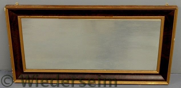 Large mahogany ogee mirror, late 19th c., with gi: Large mahogany ogee mirror, late 19th c., with gilt trim. 28.5”x55.5”