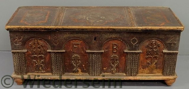 Continental dower chest dated 1804 with carved fl: Continental dower chest dated 1804 with carved flowers and birds, original paint decoration and initialed “F.B.” in the center front panel. 19.75”h.x50”w.x18.5”d.