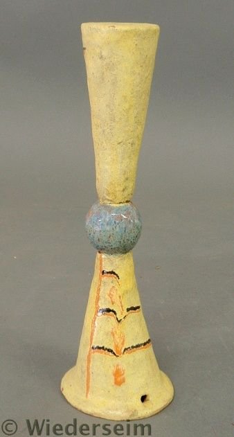 Yellow glazed earthenware object marked “Made in: Yellow glazed earthenware object marked “Made in Austria” and with Wiener-Werkstatte marks and “KR”. Repaired. 11.75”h.