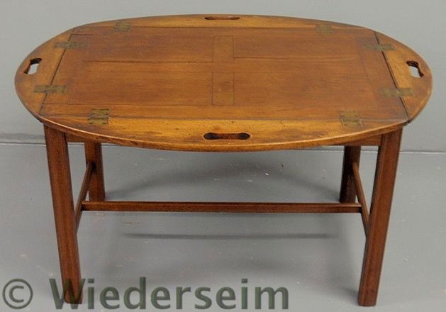 Chippendale style mahogany butler’s tray table wi: Chippendale style mahogany butler’s tray table with square molded legs. 18”h.x25”w.x34”l.