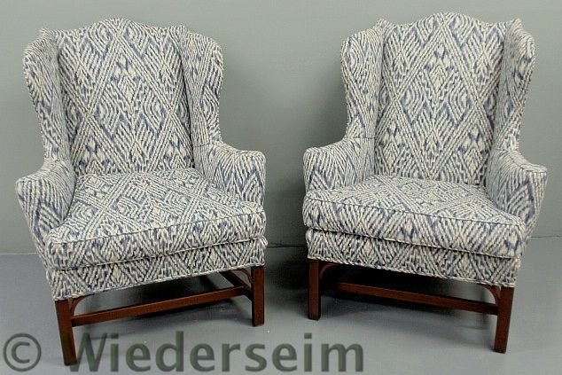 Pair of Chippendale style mahogany wing chairs by: Pair of Chippendale style mahogany wing chairs by Kittinger. 46”h.x36”w.x26”d., seats 22”h.