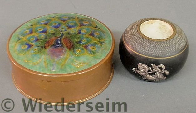 Arts & Crafts hammered copper round box, the lid: Arts & Crafts hammered copper round box, the lid with enameled peacock decoration 1.5”h.x4.5”dia. and a porcelain inkwell with raised white horse-drawn chariots on a black reserve 2”h.