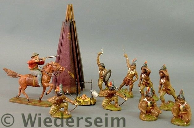 Eight Elastolin Indian figures, tallest 5.5”h., t: Eight Elastolin Indian figures, tallest 5.5”h., teepee, campfire and an unmarked figure of a cowboy on horseback.
