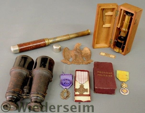 Misc. grouping to include: cased 19th c. gentlema: Misc. grouping to include: cased 19th c. gentleman’s microscope 7”l., leather and chrome cased brass telescope 6.5”l, closed, pair of binoculars, carved wood eagle, medal “Medaille Militaire��