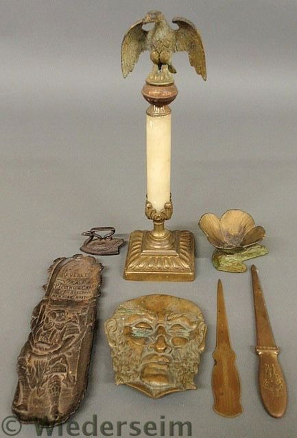 Group of metal and cast iron items, bronze eagle: Group of metal and cast iron items, bronze eagle and alabaster decorative column 13”h., 2 brass advertising letter openers, Japanese metal ashtray, bronze ashtray of a man’s face 6”h., miniature