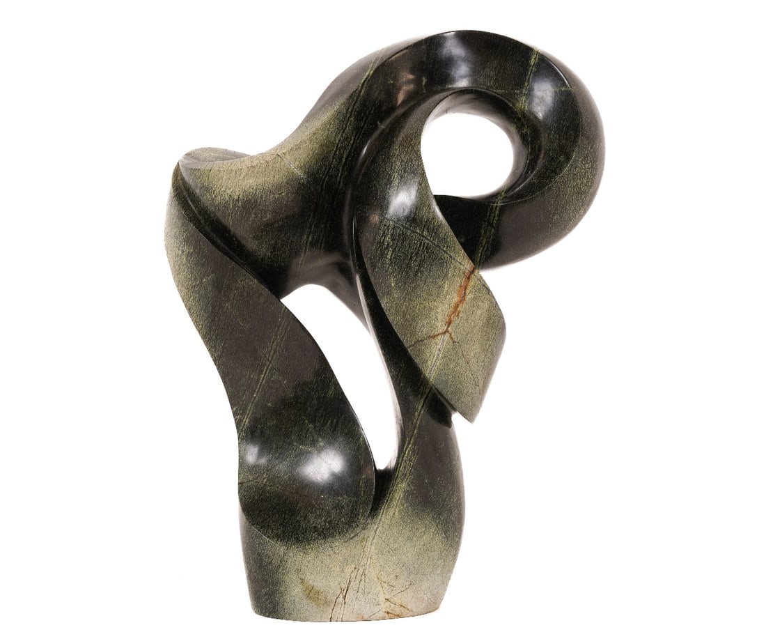 STONE SCULPTURE: Abstract hand carved lemon stone Shona sculpture. 17"h x 13"w x 7.5"d