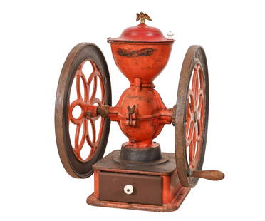 LANDERS FRARY & CLARK: Landers Frary & Clark, New Britain, Conn., USA, tabletop double wheel coffee mill with original red paint and eagle finial, working condition. 26"h x 21.25"w x 19.5 wheel dia.