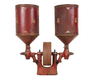 RARE ENTERPRISE BELT-DRIVEN DOUBLE HOPPER: Rare Enterprise Mfg. Co., Philadelphia, PA, belt driven double hopper coffee mill, each hopper holding 100 lbs. of coffee, one side was for pulverizing, the other for granulating. Made of cast iron an