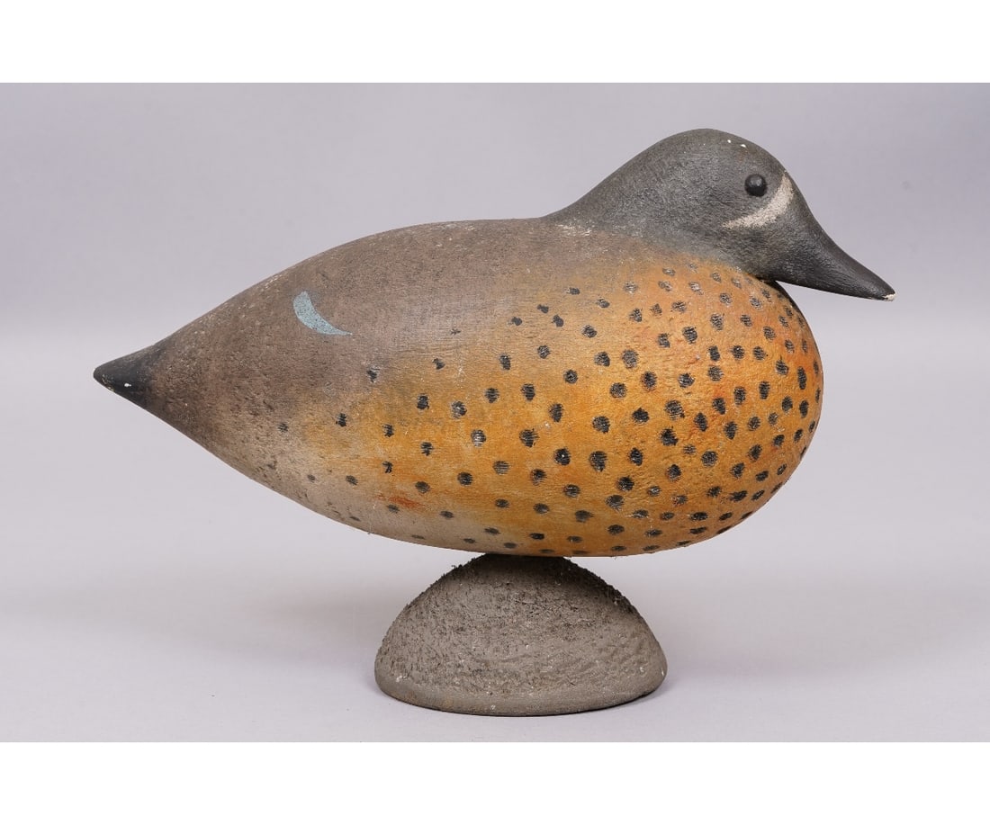 CHARLES BECK CARVED TEAL: Charles Beck carved wood painted blue wing teal with partial original label. 8.5"h x 13"l x 5"w