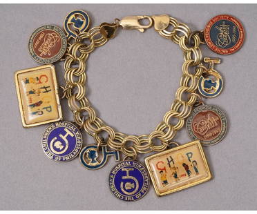 CHARM BRACELET: 14k gold charm bracelet, marked, with ten Children's Hospital of Philadelphia service recognition charms (not 14k). Bracelet: 7.25"l / 42 dwt total with charms