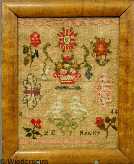 American miniature Quaker wool on linen sampler wr: American miniature Quaker wool on linen sampler wrought by H.M. Hawley 1844, with flowers, butterflies and birds and mounted in a curly maple frame. 9"x6.75"