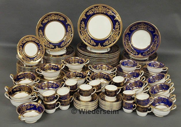 Assembled set of Cauldon bone china dinner service: Assembled set of Cauldon bone china dinner service, blue with leafy gilt decoration, to include: 16 dinner plates 10.5", 16 luncheon plates 9", 10 soup plates 8.75", 15 bouillon cups and 16 underplate