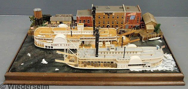 Diorama of the steamship Robert E. Lee and the Cho: Diorama of the steamship Robert E. Lee and the Choctaw with warehouse buildings, docks and water, with glass display case. 14.5"h.x36.5"w.x24.5"d.
