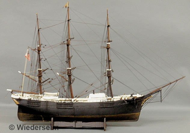 Wood ship model of a three-masted clipper ship wit: Wood ship model of a three-masted clipper ship with a Plexiglas case. Model 27"h.x36"l.