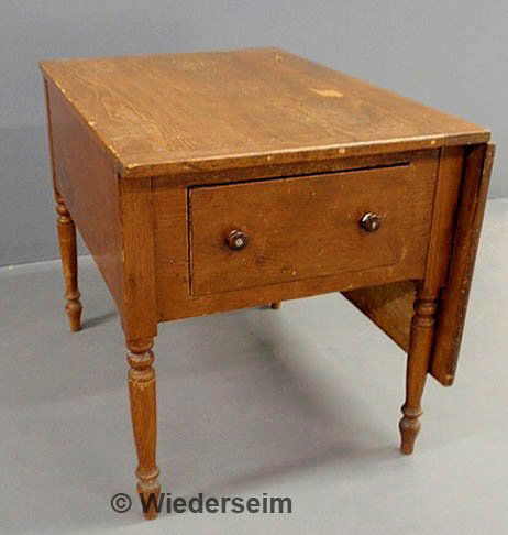 Unusual Sheraton country pine work table with two: Unusual Sheraton country pine work table with two drawers, a single drop leaf and turned legs. 29"h.x38"d.x26"l.