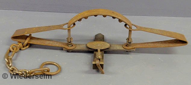 Large iron bear trap marked "Grizzly Bear No. 6, P: Large iron bear trap marked "Grizzly Bear No. 6, Pat. 1850". 11"h.x44"l.